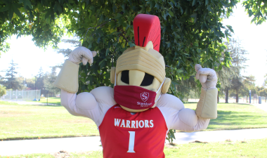 Titus wearing face covering