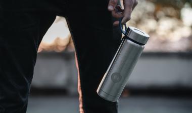 Man holding a hydro flask.