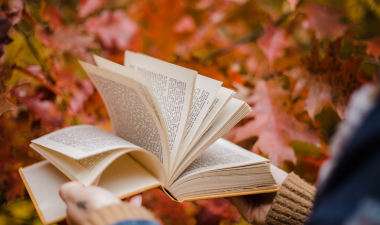book with fall backdrop