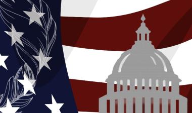 US Capitol in front of US flag with quill