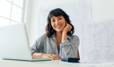 individual smiling at desk