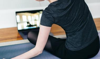 Woman doing yoga on Zoom.