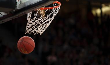 Basketball going through hoop.