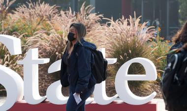 Stan State students walking on campus.