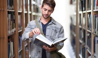 Student reading in the library