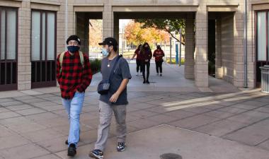 Students walking outdoors on campus.