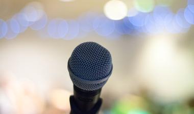 Microphone with lights in the background