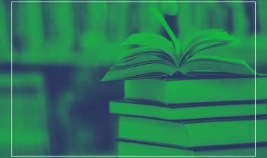 Stack of books with green background