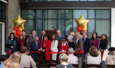 Campus leaders, community members at the Library's ribbon cutting. 