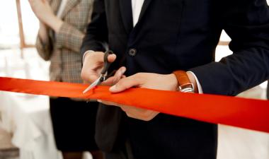 Front view cutting of red ribbon.