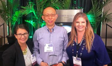 Geng Liu accepts award for University