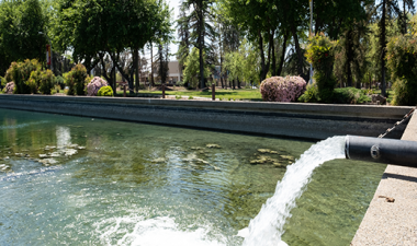 Water flowing from a pump into the Reflecting Pond.
