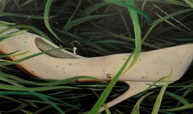 Urban artifacts, shoe in grass