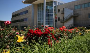 View of Mary Stuart Rogers Educational Services Gateway Building from roses