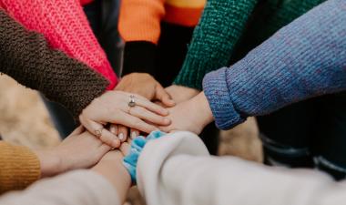 Hands over each in support