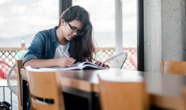 Student writing in a journal