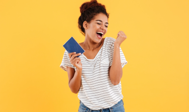 female student holding passport booklet