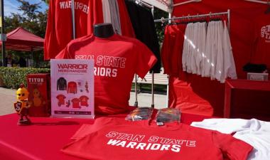 Table with shirts on display reading &quot;Stan State Warriors&quot;