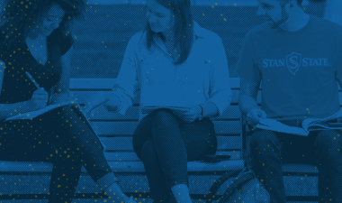 Students sitting outdoors.