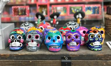 Dia De Los Muertos skulls lined up on a table