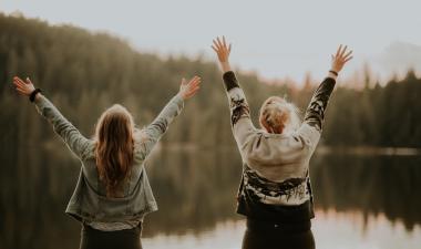 two women with hands up