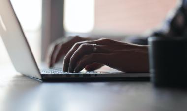 person typing on Laptop