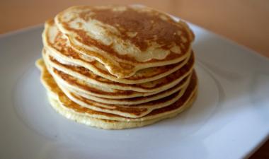 Stack of pancakes on a white plate