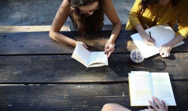 students writing and discussing