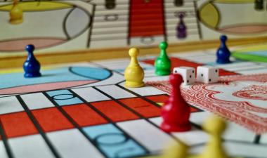 Board game pieces, dice, and cards