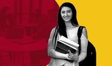 girl standing with books in hand
