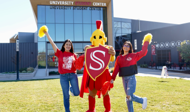 Titus with students on the Warrior Lawn