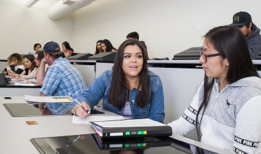 Students seated inside a classroom during a lecture.