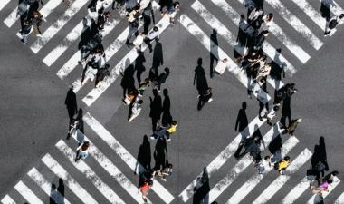 People walking across a crosswalk