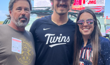Joe Ryan (center) with Stan State Assistant Coach Mike McNeil and Coach McNeil's daughter