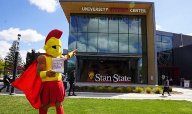 Titus mascot pointing at the Student Center