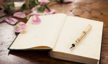 an open book and pen