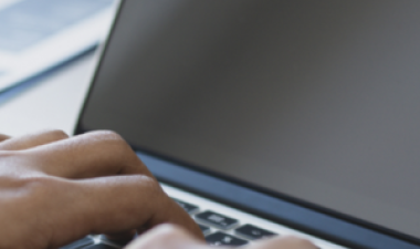 Person typing on a computer