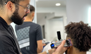Marty Torres Green cuts a clients hair.