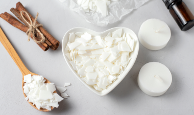 a heart shaped bowl with candle wax warming in it