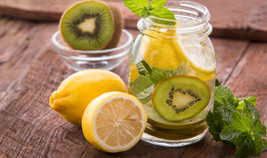 kiwis and lemons in a pitcher of water