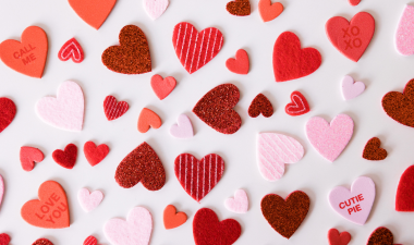 various Valentine Sweetheart heart shaped candies spread across a white background.