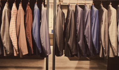 business dress attire hanging from a clothing rack