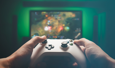 a first person point of view of someone holding a video game controller in front of the tv