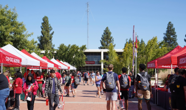 Turlock campus quad with people and tents