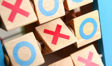tic taco toe x's and o's on wooden blocks.