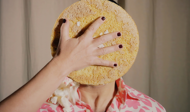 a pie being thrown in a persons face