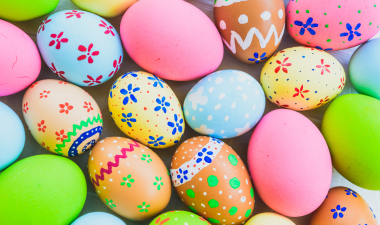 an assortment of easter eggs in different colors and patterns spread out on a table.