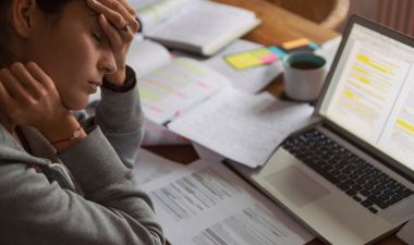 a person who looks stressed over the amount of work in front of them