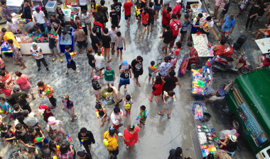 Aerial view of a crowded market selling Asian market goods.