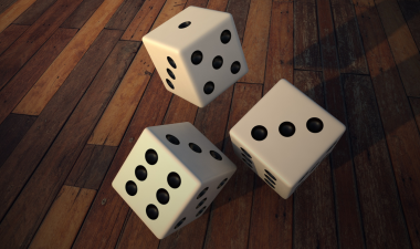 Three, 3D rendered dice caught mid roll onto a table.